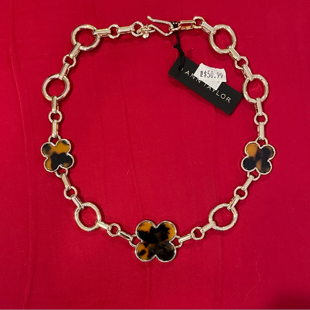 Ann Taylor necklace with gold tone and tortoise shell colored icons. NWT.